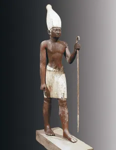Statue of Sesostris I. 1971 -1928 BC. The Pharaoh appears here with a White Crown from the Upper Egypt. Painted cedarwood. Egyptian art. Middle Kingdom. Sculpture on wood. EGYPT