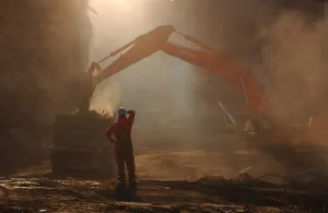 Rubble Prints: Steam shovel loads debris from the World Trade Center disaster site for transport to the Staten Island landfill