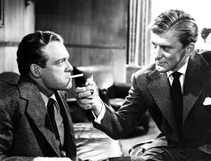 Lighting Cigarette Prints: THE STRANGE LOVE OF MARTHA IVERS, from left, Van Heflin, Kirk Douglas, 1946