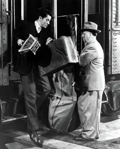 Tennis Racquet Prints: STRANGERS ON A TRAIN, director ALFRED HITCHCOCK makes a cameo appearance