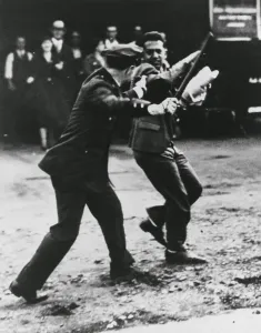 Lcgr1305 Prints: A striker dodges policeman's night stick during San Francisco General Strikes. 1934