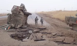 Craters Prints: Stryker vehicle lies on its side after surviving a IED blast in 2007