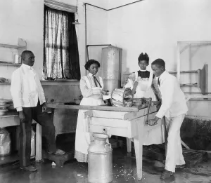 Students Prints: Students operating a small cotton gin at the Tuskegee Institute