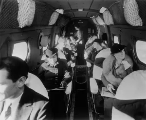Stewardess Prints: Stylishly dressed passengers seated in a commercial flight in the 1930s. LC-DIG-hec-14562
