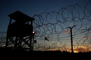 Cuba Prints: The sun sets on Camp X-Ray's first day as an active compound on Jan. 11 2002