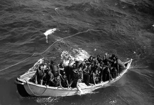 Seamen Prints: Survivors of USS Princeton in life boat as seen from USS Cassin Young