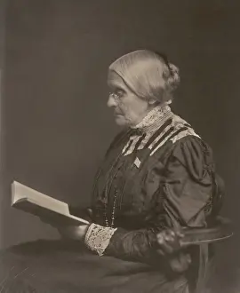 Suffrage Prints: Susan B. Anthony sitting and reading a book