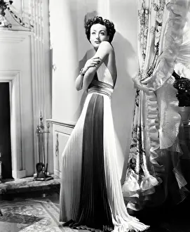 Images Dated 2nd May 2019: SUSAN AND GOD, Joan Crawford, in a gown by Adrian, 1940
