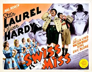 Hardy Prints: SWISS MISS, from left: Oliver Hardy, Stan Laurel on title lobbycard, 1938