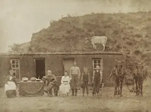 Migration Prints: The Sylvester Rawding family in front of sod house