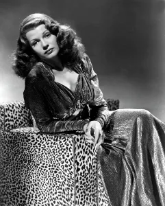 Sitting In Chair Prints: TALES OF MANHATTAN, Rita Hayworth