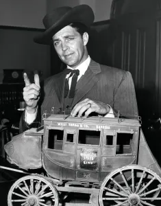 1950s Candids Prints: TALES OF WELLS FARGO, Dale Robertson, with a model of the titular mail coach, 1957-62