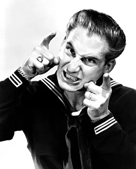 Comic Prints: TARS AND SPARS, Sid Caesar (imitating a gunner aiming at an enemy plane), 1946
