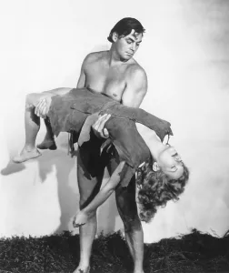 Brenda Prints: TARZAN AND THE AMAZONS, Johnny Weissmuller (standing), Brenda Joyce, 1945