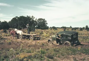 December Prints: Team of horses pulling a car out of the mud on an unimproved rural roads near Pie Town New Mexico