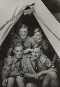 Blond Hair Prints: Teenage boys wearing Nazi uniforms boys in a tent
