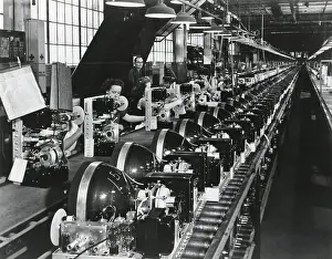 Electronics Prints: Television chassis on an assembly line with women workers in a U