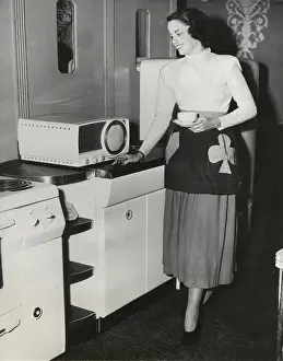 Model Prints: A television in the kitchen for the first broadcast of a cooking show in New York