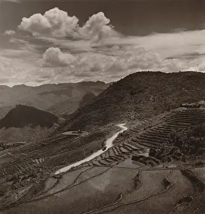 Rice Prints: Terraced fields and roadway in a mountainous region of Yunnan Province in China