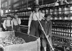 Mill Prints: A textile mill. Sweeper and doffer boys in Lancaster Cotton Mills