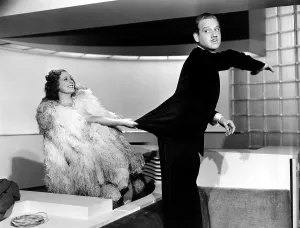 Enjoying Prints: THEODORA GOES WILD, Irene Dunne, Melvyn Douglas, 1936, catching his coattails