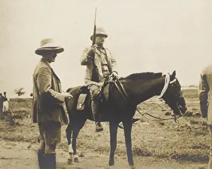 Shorts Prints: Theodore Roosevelt on horseback and holding a rifle during his safari