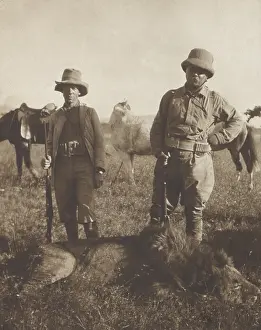 Shot Prints: Theodore Roosevelt and local scout Leslie Tarleton stand over a dead lion shot by TR