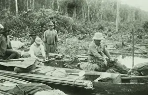 Canoe Prints: Theodore Roosevelt (right) in a heavily loaded dugout canoe, Feb. 27, 1914