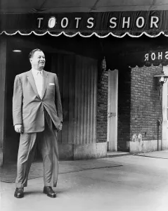 July Prints: Toots Shor in front of his famous restaurant in 1959