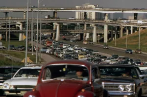 Congestion Prints: Traffic jam on a freeway with a multistory group of overpasses in the background