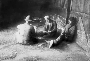 Amusements Prints: Tramps traveling in a freight car pass the time playing cards