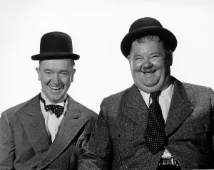 February Prints: NOTHING BUT TROUBLE, from left: Stan Laurel, Oliver Hardy, 1944