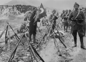 Advancing Prints: Turkish infantry column at rest with flag and rifles during World War I
