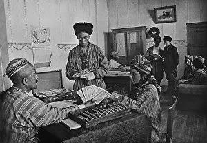 Communism Prints: Turkmenian collective farmers receiving their share of yearly profits in the 1930s