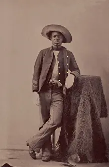 Casual Prints: An unidentified Buffalo Soldier posing with a buffalo hide studio prop