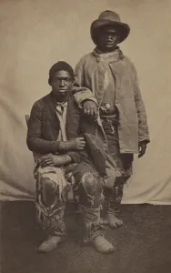 Protection Prints: Two unidentified escaped male slaves wearing ragged clothes in Louisiana during the Civil War