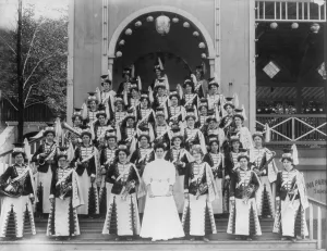 Matching Clothes Prints: Uniformed group on amusement park bandstand