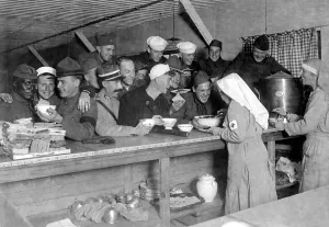 December Prints: An unusual World War I scene of an African American soldier being served with American and French service men