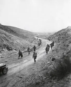Tunisia Prints: U.S. 16th Infantry, 2nd Battalion moving through the Kasserine Pass on Feb
