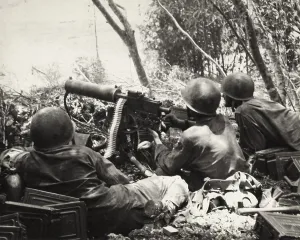 Operation Forager Prints: U.S. Army machine gun crew fires on Japanese positions on slopes of Mt