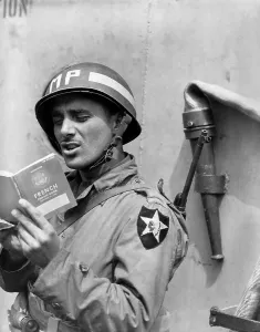 English Channel Prints: U.S. Army MP (Military Police) practices French on a ship taking him to Normandy
