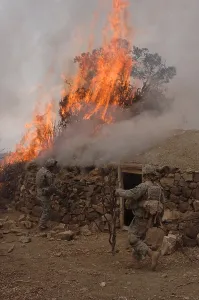 Explosions Prints: U.S. Army soldiers burn down a Taliban safe house discovered during operations in the Paktika province of Afghanistan