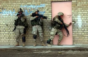 Images Dated 16th February 2011: U.S. Army soldiers are poised to enter a building in Fallujah Iraq