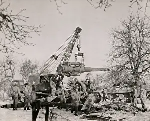 Teamwork Prints: U.S. artillerymen in France assemble their 8 inch gun with the aid of a mechanical hoister
