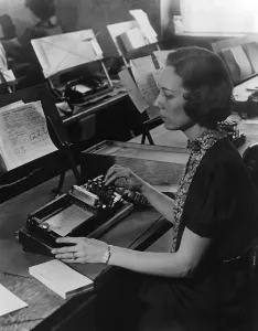 Records Prints: U.S. Census worker transferring information from a questionnaire to a punch card