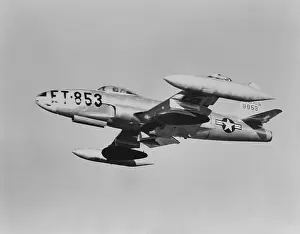 Air Force Prints: U.S. F-80 jet fighter carrying napalm in seventy five gallons dark colored wing tanks