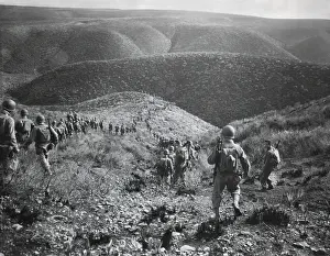 Exercise Prints: U.S. First Ranger Battalion on a speed march over hilly terrain at Arzew