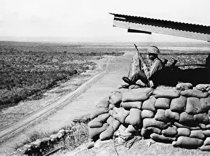 Military Bases Prints: U.S. Marine, looks across into Communist Cuba from Guantanamo Naval Base Cuba