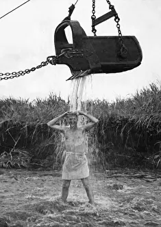 Lcgr1410 Prints: U.S. Marine officer enjoys an early morning shower at Cape Gloucester on New Britain