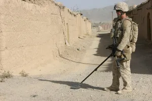 Images Dated 16th March 2011: U.S. Marine sweeping for improvised explosive devices in Now Zad Afghanistan Oct